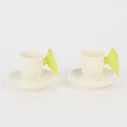 A Pair of Winged Espresso Cups and Saucers by Green & Associates