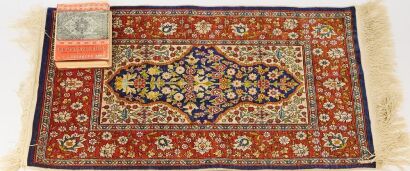 A Fine Silk Rug with Rug Identifier Book