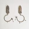 A Pair of Chinese Qing Dynasty Silver &lsquo;Lotus Bearing Son &rsquo; Curtain Hooks
