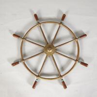 An Antique Brass Ships Wheel