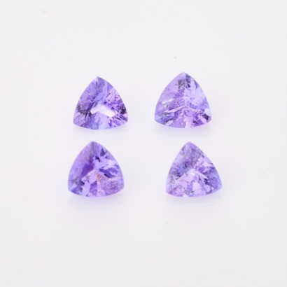 A Parcel of 4 Loose, 1.28ct Trillion Cut Tanzanites