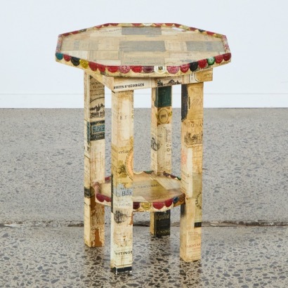 A Side Table with French Wine Bottle Decoration