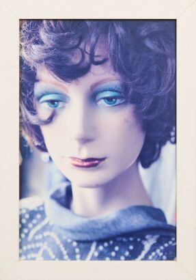 A Framed Print of a Mannequin Head origin unknown