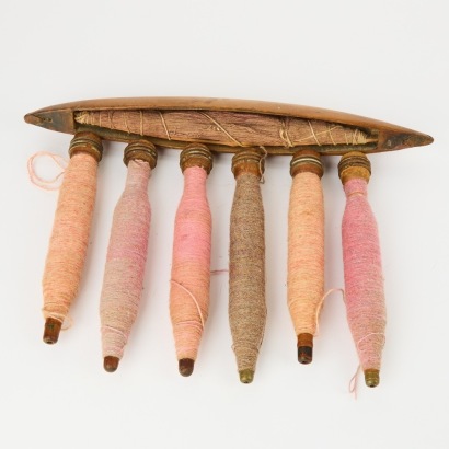 A Set of Six Vintage Middle Eastern Carpet Bobbins and Shuttle
