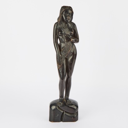 A Caved Folk Art Black Wood Figure