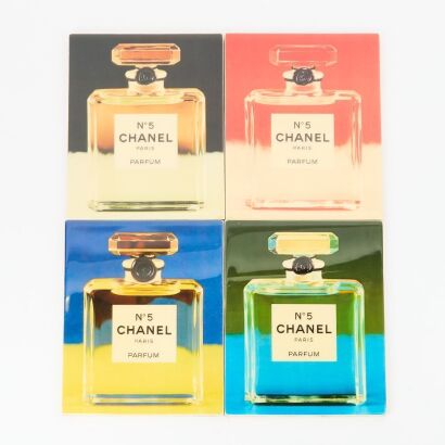A Set of Four John Fairchild Chanel No 5 Ceramic Tiles