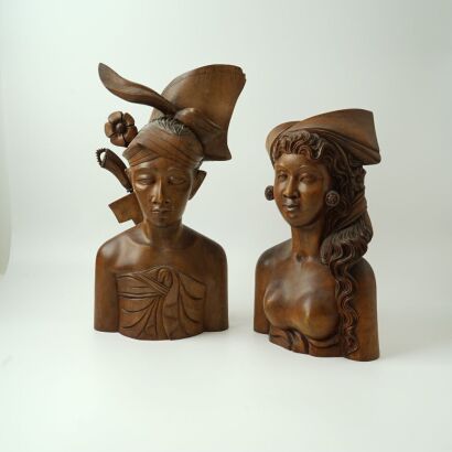 A Pair of Indonesian Carved Wooden Male and Female Busts