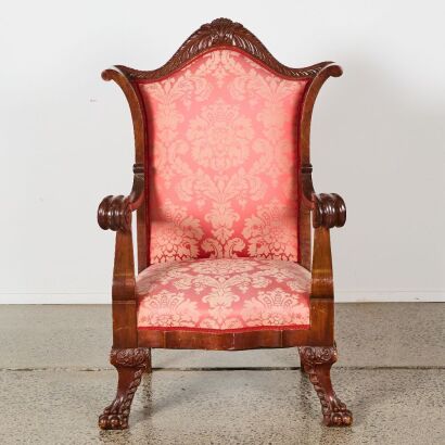 A Grandfather Chair With Scroll Arms And Claw Feet