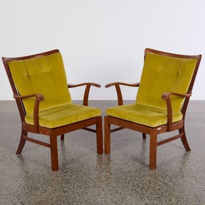 A Pair of Fritz Hansen 50's Walnut Lounge Chairs