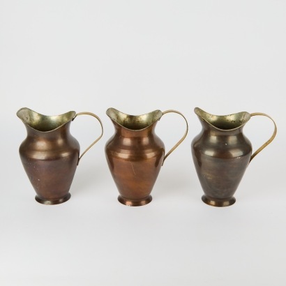 A Set of Three Turkish Copper Look Water Jugs