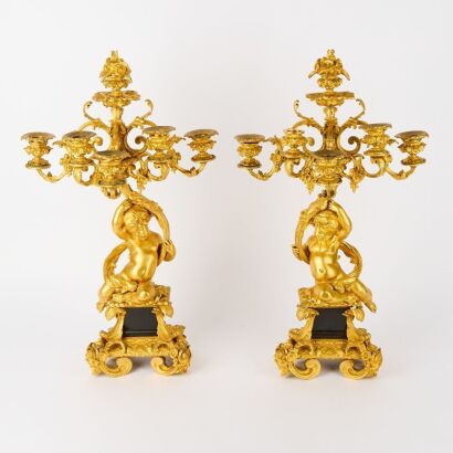 An Exceptional Quality French 19th Century Reclining Cherub Candelabras of Bronze with 24 Carat Gold Gilding