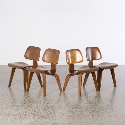 A Set of Four Early Walnut Eames DCW Chairs for Herman Miller