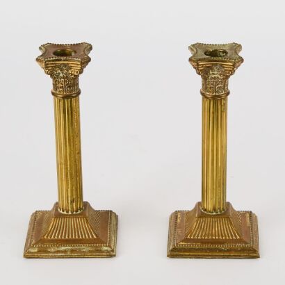 A Pair of Brass Corinthian Pillar Candle Sticks