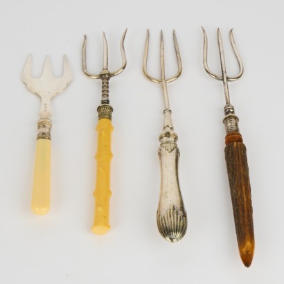A Collection of Four Antique Trident Forks