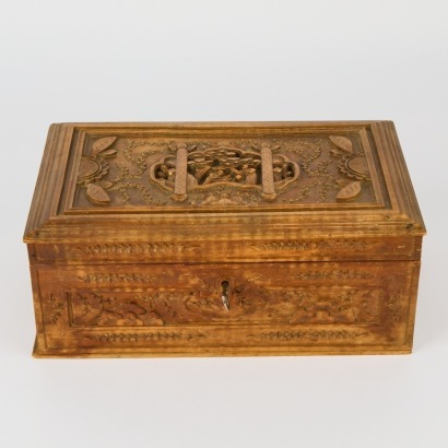 A Hand-Carved Wooden Box with Key