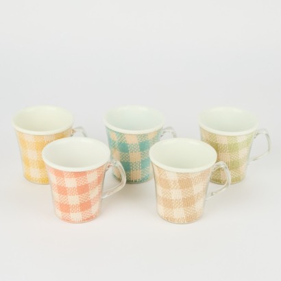 A Set of Four Vintage Raffiaware Mugs
