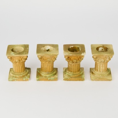 A Set of Four Vintage Column Candle Holders