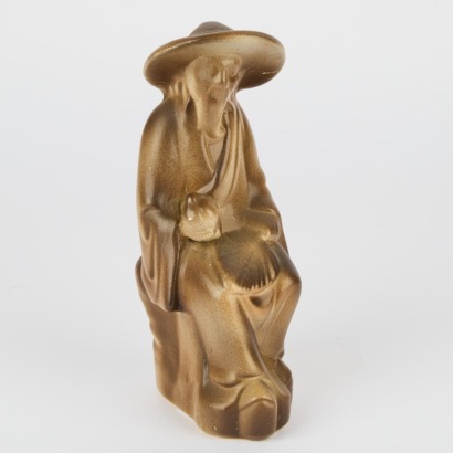An Oriental Pottery Figure