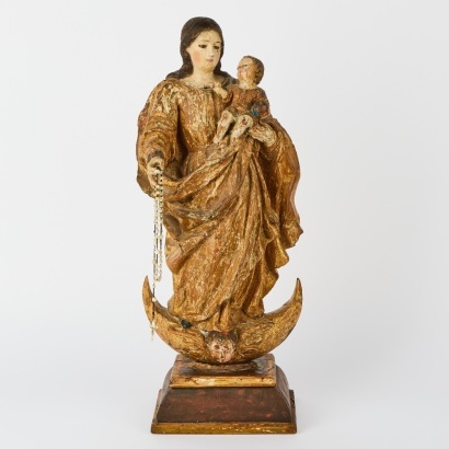 A Folk Art Virgin Mary Holding The Infant Jesus