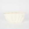 A Glazed White Clay Ribbed Vase By Dryburgh Pottery