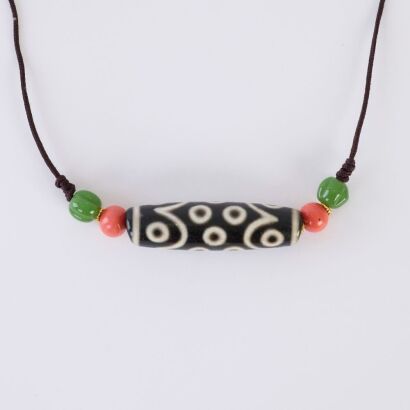 A Chinese Tibetan Old Fifteen-eyed Dzi Bead