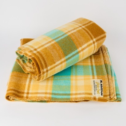 A Pair of Gold Crest Travel Blankets