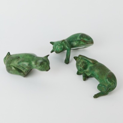 A Set of Three Bronze Shelf Cats