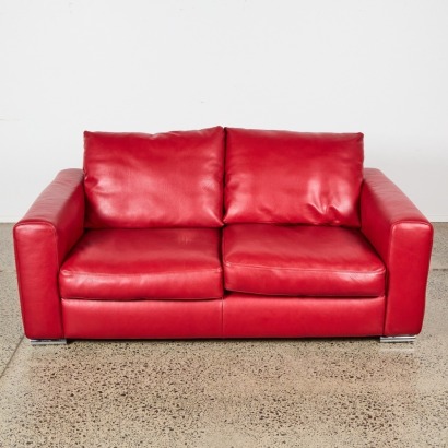 A Red Leather Two-Seater Sofa