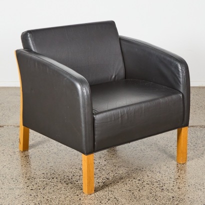 A Single Black Leather & Oak Lounge Chair