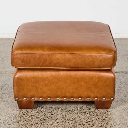 A Brown Leather Footstool