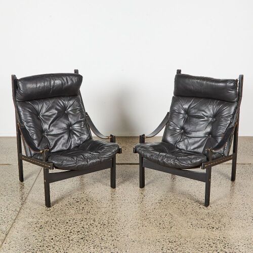 A Pair of Mid-Century Black Leather Safari Chairs
