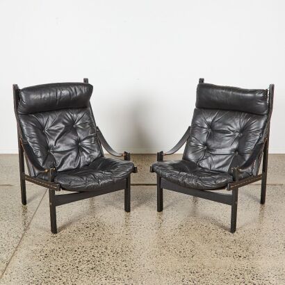 A Pair of Mid-Century Black Leather Safari Chairs