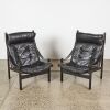 A Pair of Mid-Century Black Leather Safari Chairs
