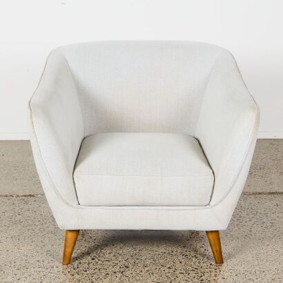A Contemporary Armchair in Grey Fabric
