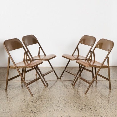 A Set of Four Lyon Aurora Machine Age Folding Metal Chairs