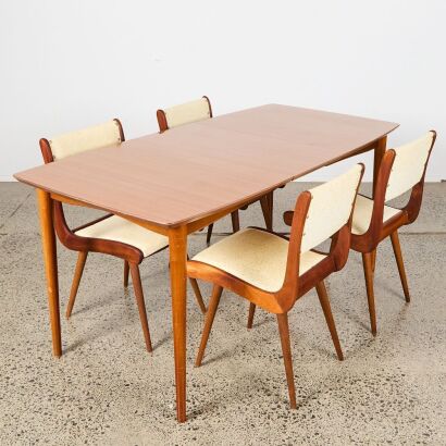 A Jon Jansen Dining Suite With Extending Table and Four Chairs