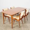 A Jon Jansen Dining Suite With Extending Table and Four Chairs
