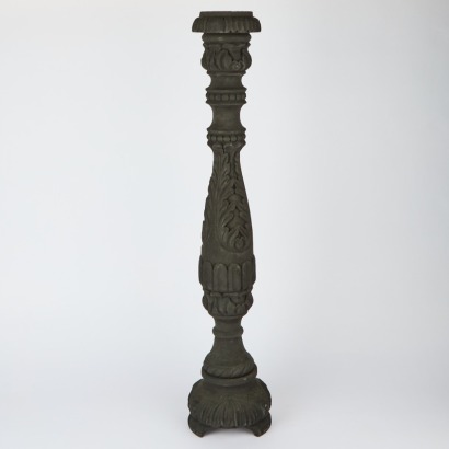 An Ornately Carved Floor Standing Candle Holder
