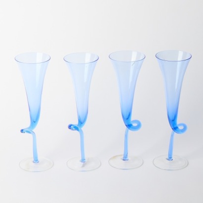 A Set of Four Twisted Stem Blue Glass Champagne Flutes