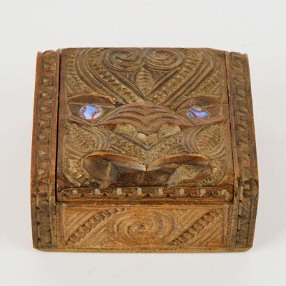 A Carved Maoriana Box With Paua Eyes