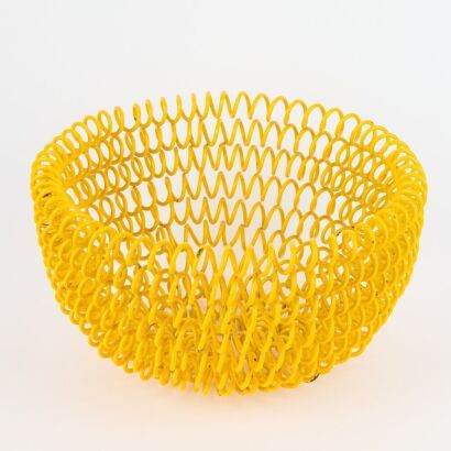 A Vintage Yellow Lacquered Steel Coil Basket