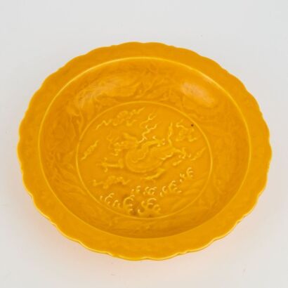 A Chinese Yellow-glazed &lsquo;Sea-dragon&rsquo; Dish (Da Ming Xuande Mark)