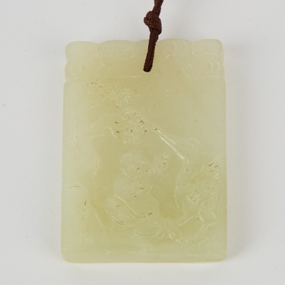 A Chinese Celadon and White Jade Carved &lsquo;Boy&rsquo; Pendant