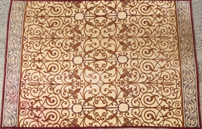 An Italian Floral And Vine Motif Rug