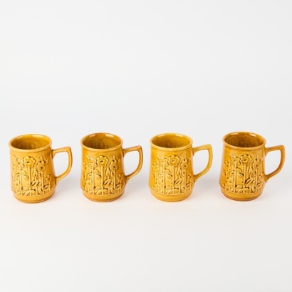 A Set of Four Honey Glazed Crown Lynn Mugs