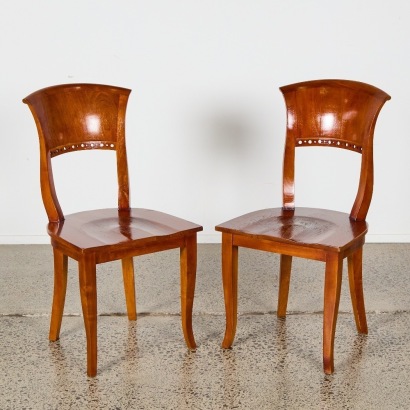 A Pair of Solid Teak Chairs