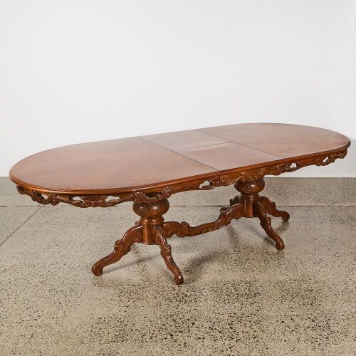 A Marquetry Inlaid Extension Dining Table on Carved Twin Pedestal Base