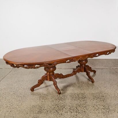 A Marquetry Inlaid Extension Dining Table on Carved Twin Pedestal Base