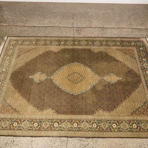 A Handknotted Tabriz Rug