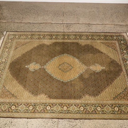 A Handknotted Tabriz Rug